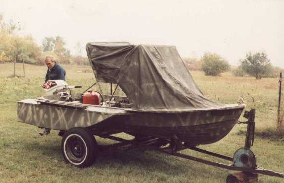 hull of a 14 ft v-hull (with built in gun cabinets) and dropped a 7.5